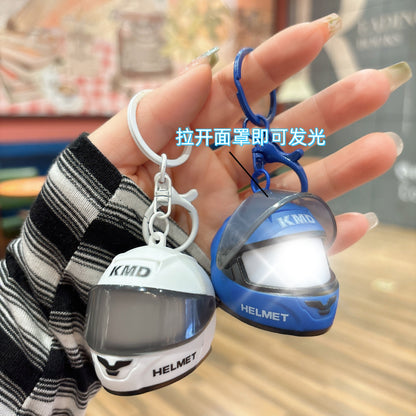 Creative luminous helmet-shaped keychain, stylish and eye-catching, a portable motorcycle accessory for couples' bags - image 1