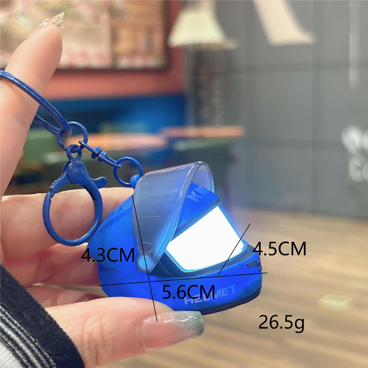 Creative luminous helmet-shaped keychain, stylish and eye-catching, a portable motorcycle accessory for couples' bags - image 4